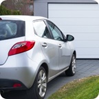 Silver vehicle sits in driveway.